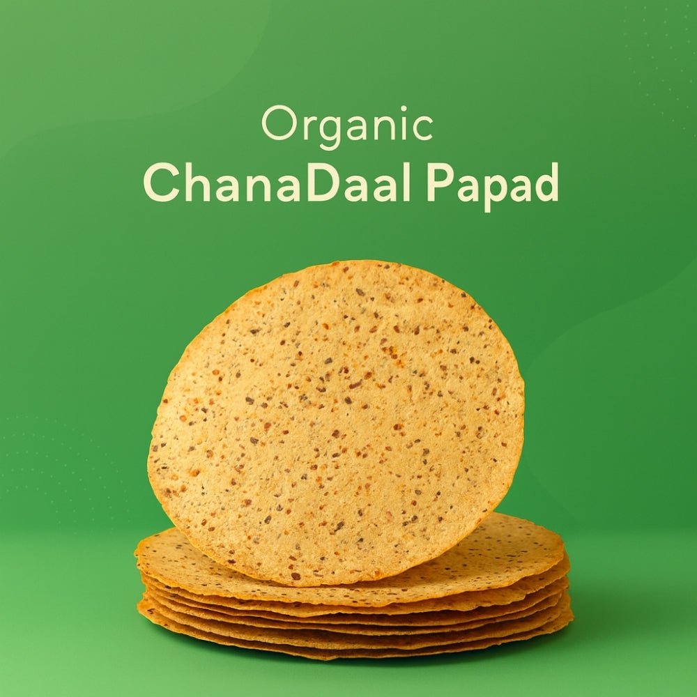 Stack of Organic ChanaDaal Papad on a green background with text.